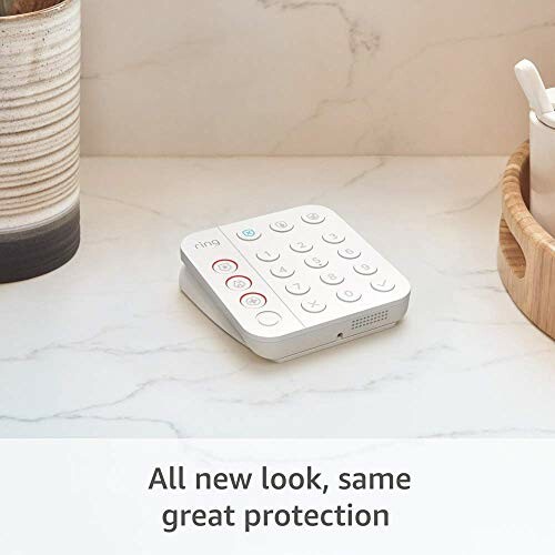 Home security keypad on a marble countertop